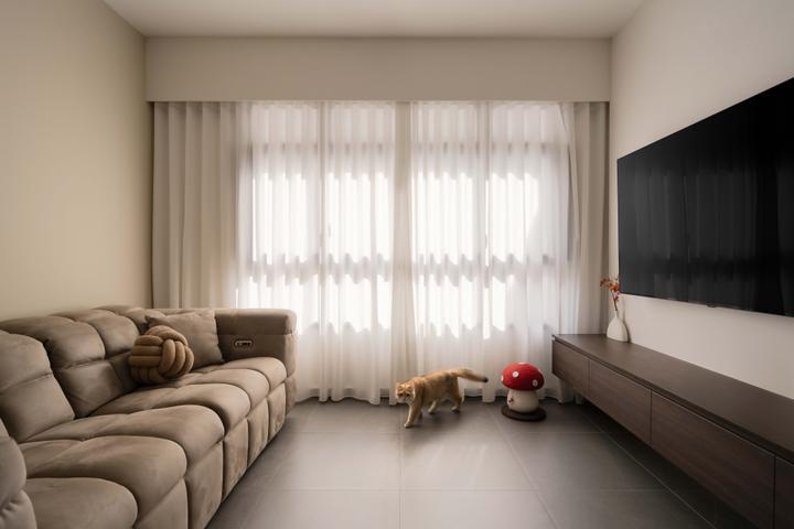 HOFT's Plantation Crescent living room with a sofa and full-height curtains